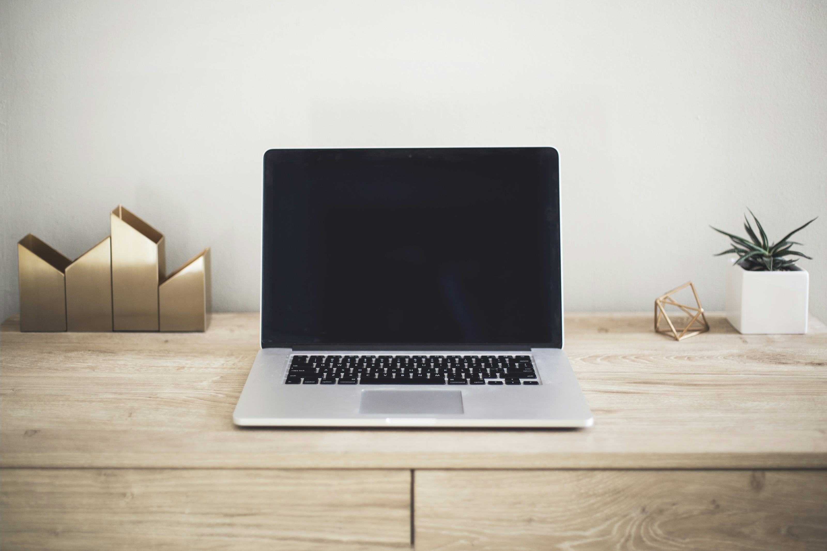 A laptop in a bright, uncluttered workspace